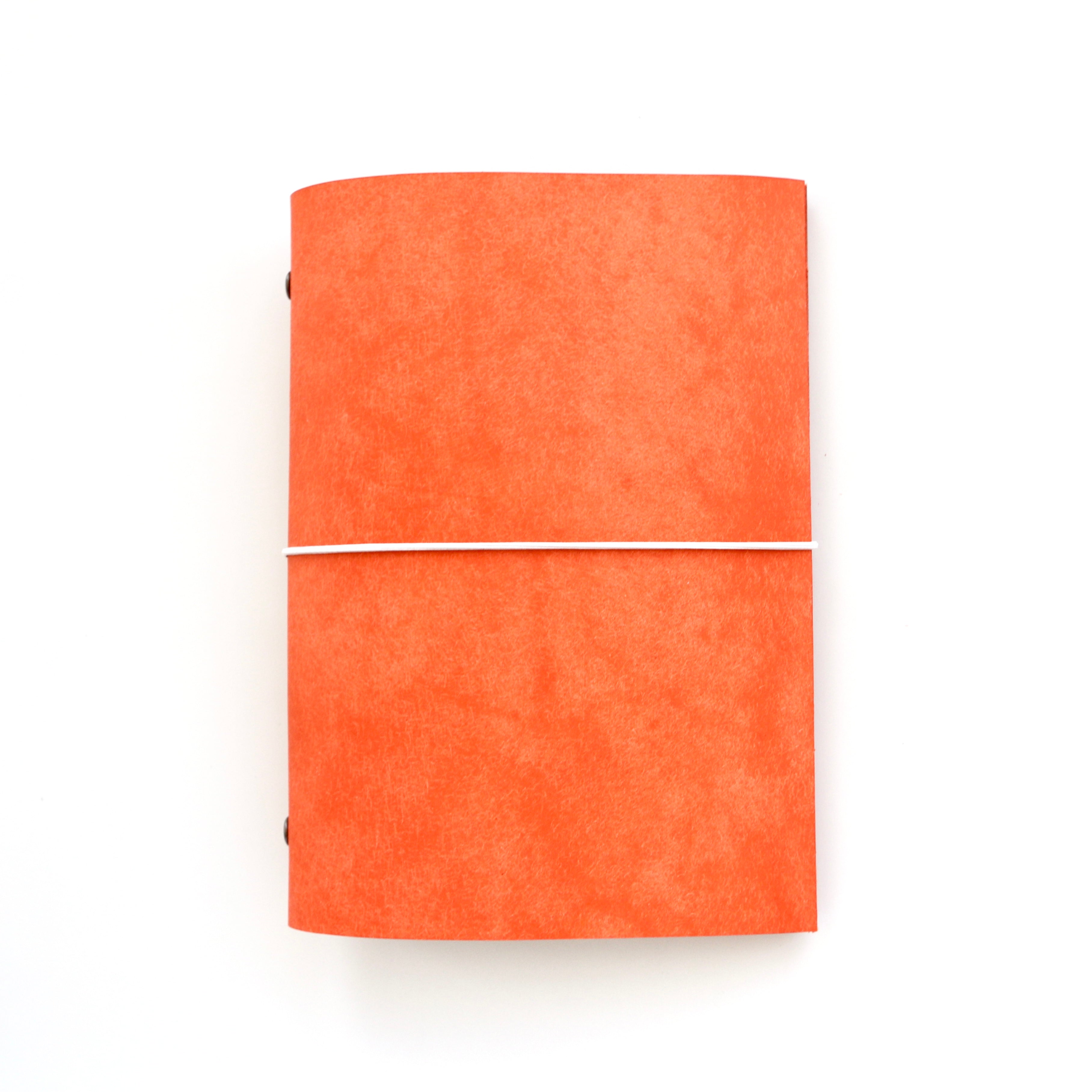 Orange journal on a white background