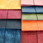 Stacks of colorful journal arranged in a grid pattern.