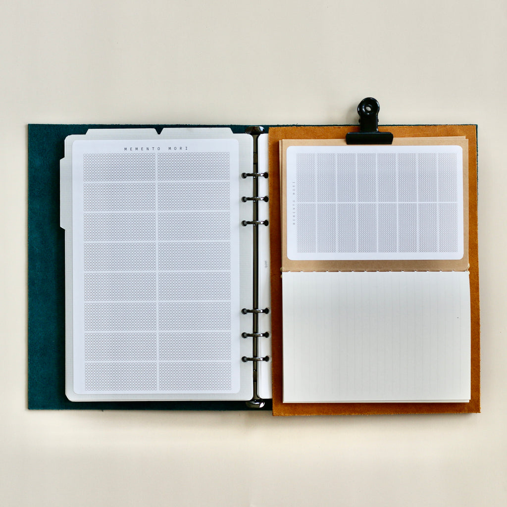 Open planner with different page designs on a white background