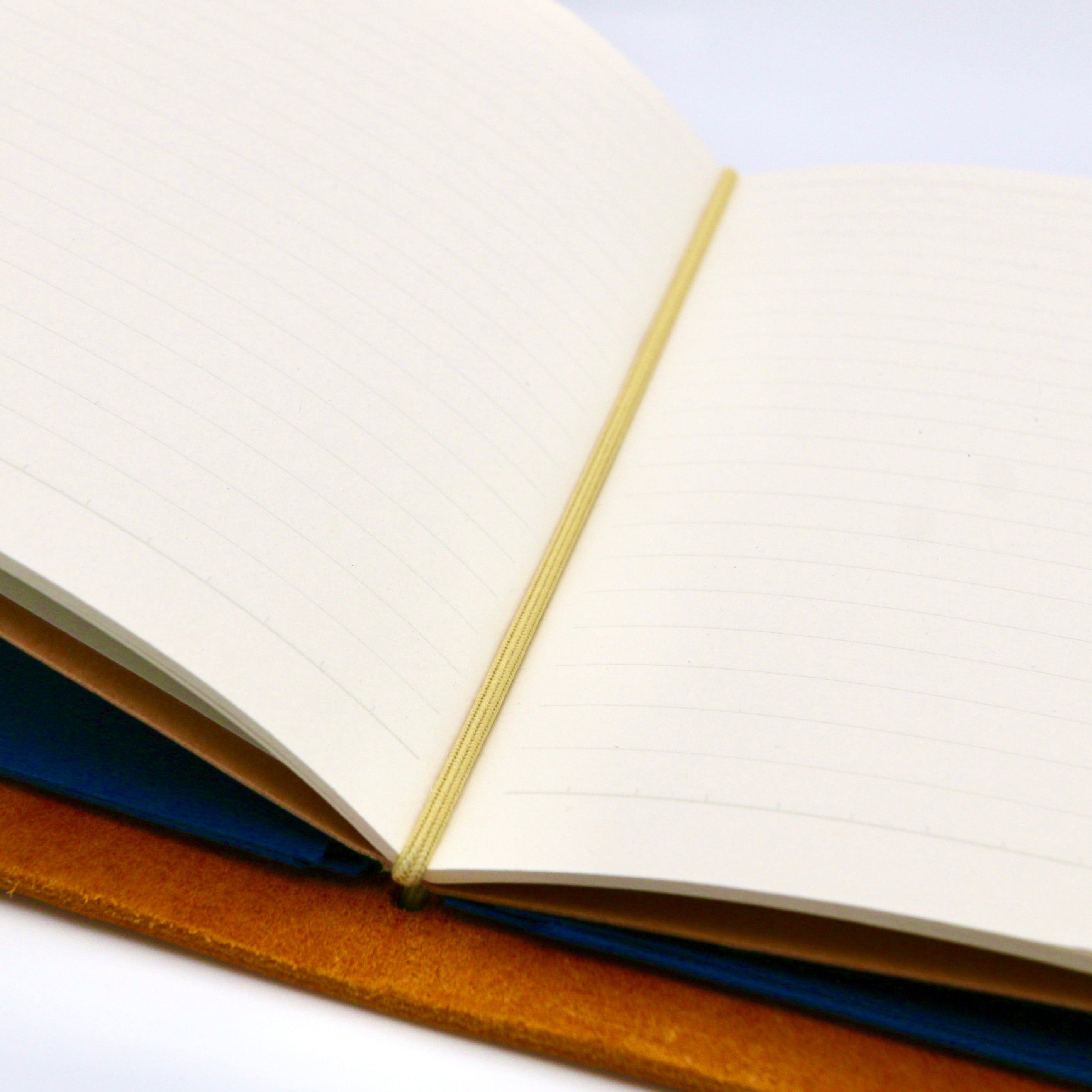 Open notebook with lined pages on a white background