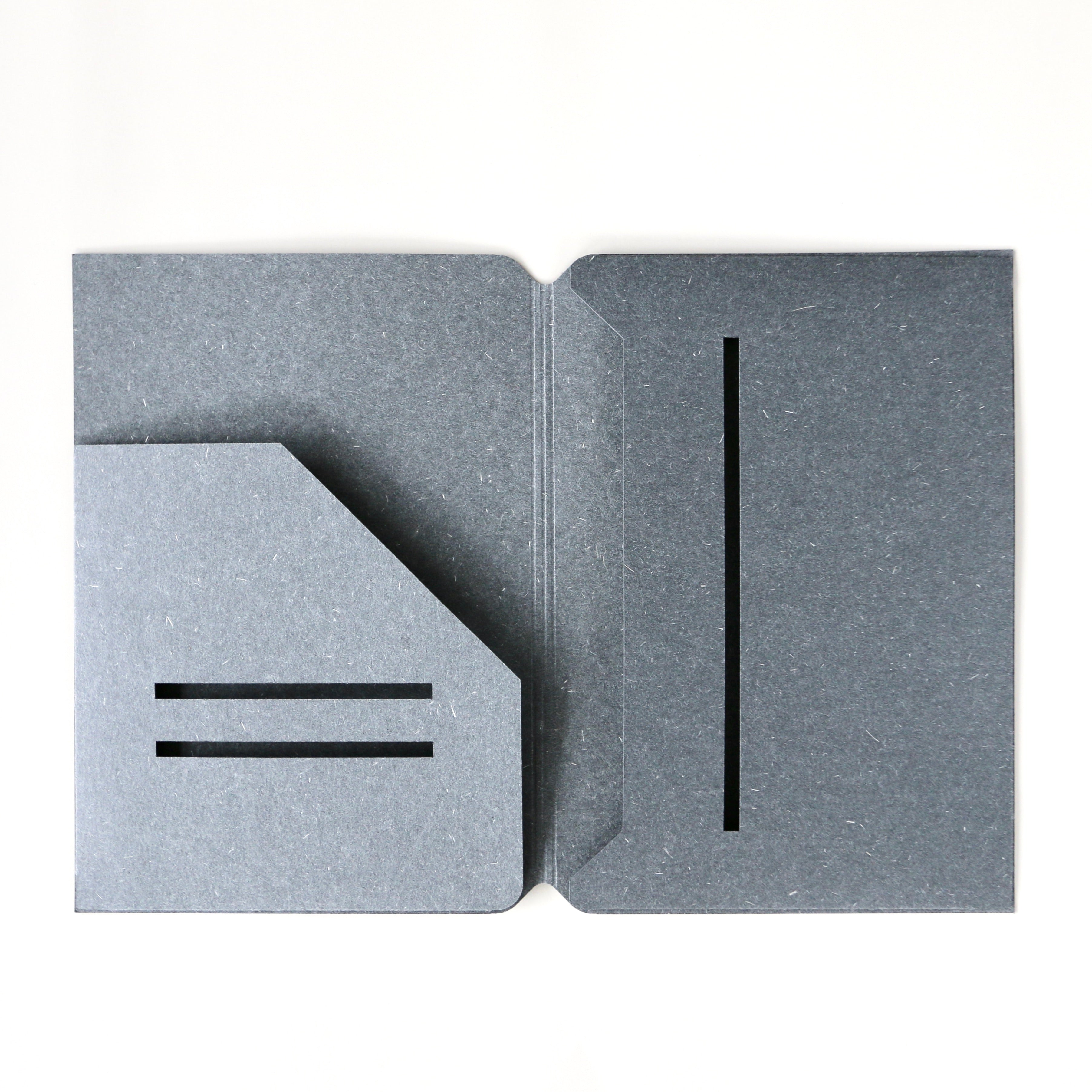 Gray textured folder with cut-out design on a white background