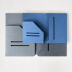 Two blue and gray journal pocket folders on a white background