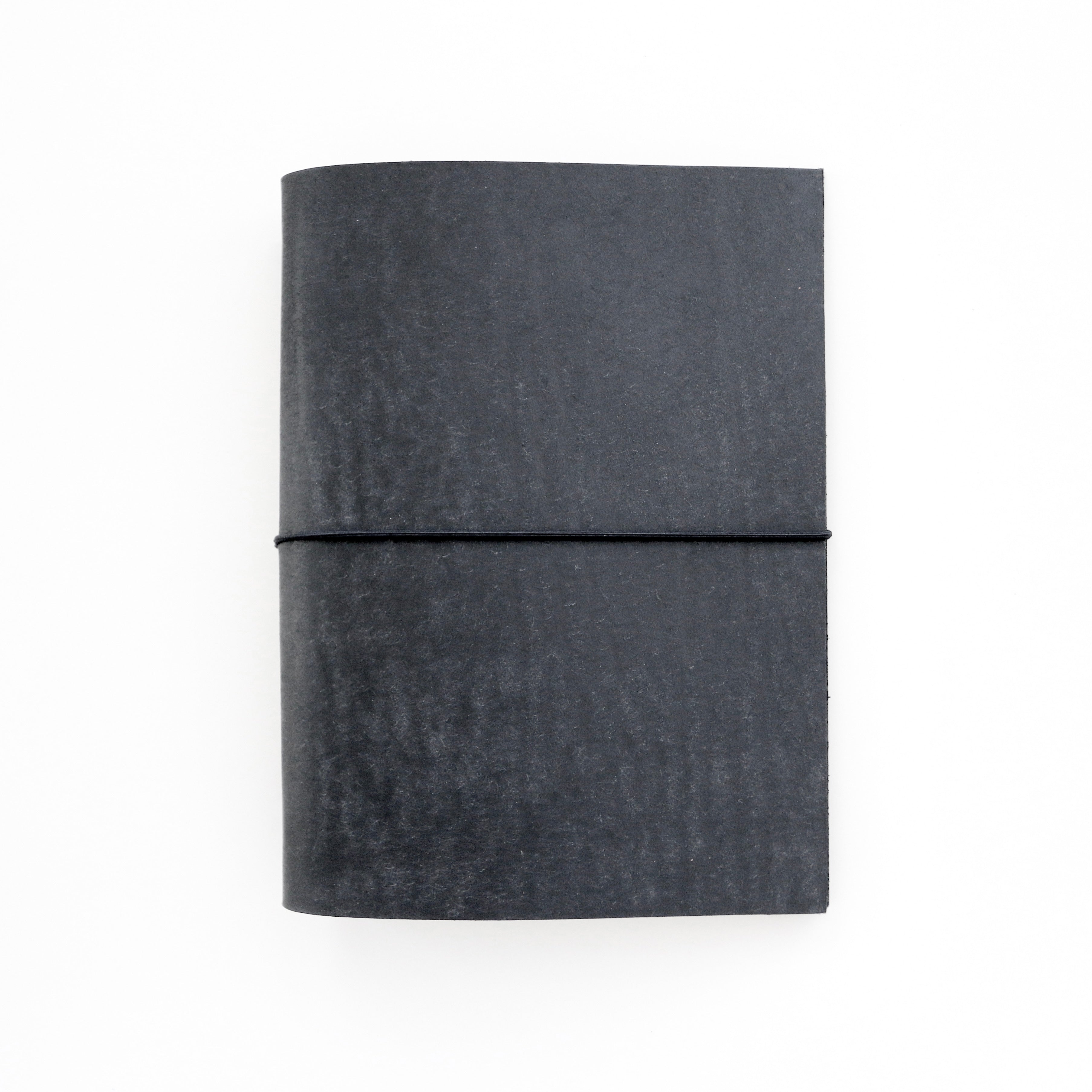 Black leather-bound notebook on a white background